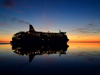 Ship at sea at sunset