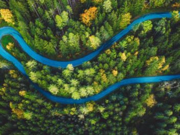 vtt-aerial-shot-winding-road-through-forest
